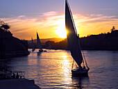 Feluccas on River Nile at dusk, Aswan, Egypt