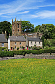 View of village church and cottages, Hartington, Derbyshire, UK, England
