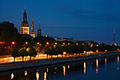 Daugava River with view of castle and churches at night, Riga, Latvia