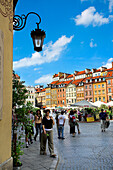Tourists in the Old Town Square, Warsaw, Poland
