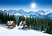 View of mountains over chalets in winter, Tatra Mountains, Poland