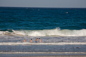 Children bathing in the sea, Playa Bajo Negro, Parque Natural de Corralejo, Fuerteventura, Canary Islands, Spain, Europe