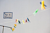 Clothesline, washing line with pegs against a white wall, Odeceixe, Algarve, Portugal