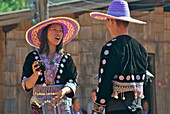 Hmong woman and man with ball dressed in traditional costume, Mae Rim Valley, Hmong village,  Province Chiang Mai, Thailand, Asia