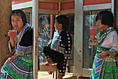 Hmong children dressed in traditional costumes drinking lemonade, Mae Rim Valley, Hmong village, Province Chiang Mai, Thailand, Asia
