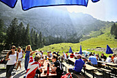 Guests in beer garden, mountain hut Tutzinger Huette, Bavarian Alps, Bavaria, Germany