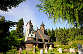 Stave church Wang and graveyard in the sunlight, Karpacz, Bohemian mountains, lower-Silesia, Poland, Europe