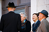 Elderly people talking church, Cividale del Friuli, Friuli-Venezia Giulia, Italy