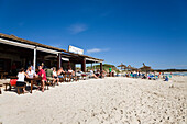 People sitting in a beach bar at the beach of Es Trenc, Mallorca, Balearic Islands, Spain, Europe