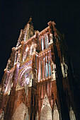 Illuminated Notre Dame Gothic cathedral (14th century),  Strasbourg. Alsace,  France