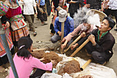 Men smoking at market,  Bac Ha. Lao Cai,  Vietnam.