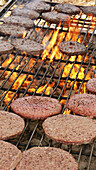 Hamburgers on a charcoal grill