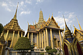 Buildings of the Royal Grand Palace under clouded sky, Bangkok, Thailand, Asia