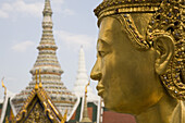 Statue and towers of the Royal Grand Palace, Bangkok, Thailand, Asia