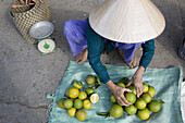 Vietnamese woman at the market at Cai Rang, Mekong Delta, Can Tho Province, Vietnam, Asia