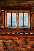 Window of an alpine hut on mountain Staffel, Jachenau, Alps, Bavaria, Germany