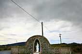 Statue of Virgin Mary under grey clouds, Magharees, Stradbally Strand, Dingle Peninsula, County Kerry, west coast, Ireland, Europe