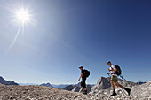 Two hikers on Zugspitzplatt, Wetterstein range, Bavaria, Germany