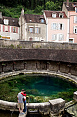A Couple In Front Of The Mysterious Spring La Fosse Dionne, Tonnerre, Yonne (89), Burgundy, France