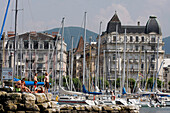 Bathing And Relaxing On The Marina In The Geneva Harbour On Lake Geneva, Switzerland