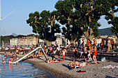 Bathing And Relaxing On The Beach Of The Bains De Paquis On Lake Geneva, Geneva, Switzerland