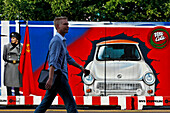 Boarded Fence Illustrating The Cold War And Checkpoint Charlie With A Trabant, Symbol Of East Germany, Berlin, Germany