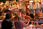 Stand Of Salamis, Smoked Ham And Other Pork Products At The Market 'La Boqueria', Culinary Temple Become One Of The Biggest Markets In Europe, 'El Raval' Neighborhood, Barcelona