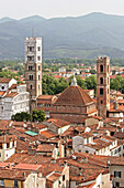 Saint Martin Cathedral, Duomo San Martino And San Giovanni Church, Seen From The Roofs Of Lucca, At The Bottom Of The Garfagna Valley And The Foothills Of The Apuane Alps, Tuscany, Italy