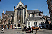 Horse And Buggy In Front Of The De Nieuwe Kerk, The New Church On The Dam Platz Right Next To The Royal Palace. It No Longer Has Any Religious Functions And Presently Houses Exhibitions On Different Countries, Religions And Cultures. Dedicated To The Virg