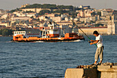 Fisherman, Cacilhas Across From Lisbon On The Other Bank Of The Tagus, Portugal