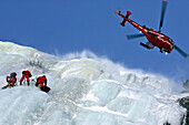 Rescuers Winched Up Into A Helicopter, Cascade Of The Pas De La Chevre, Emergency Services Mountain Team, Haute-Savoie, France