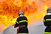 Extinction Of A Fire With 2 Foam Hoses. Training Of The Firefighters Of The Sdis38 In Hydrocarbon Fires, Gesip (Studies Group For Safety In The Petrol And Chemical Industries) Of Roussillon, Isere (38), France