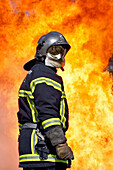 Fireman In Front Of A Wall Of Flames Before Attacking A Lpg (Light Petroleum Gas) Fire, Sdis Of Morbihan, Vannes, Morbihan (56)