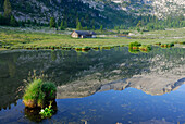 Reflection of mountains on lake Gruensee, Fanesalm, Naturpark Fanes-Sennes-Prags, Dolomites, Trentino-Alto Adige/South Tyrol, Italy