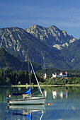Lake Forggensee with sailboat, Fuessen, Allgaeu, Swabia, Bavaria, Germany