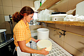 Woman preparing cheese, Upper Bavaria, Bavaria, Germany