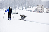 Back-country skier near Saoseo mountain lodge, Puschlav, Grisons, Switzerland