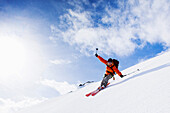 Woman downhill skiing, Wildhorn, Bernese Alps, Canton of Valais, Switzerland