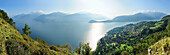 Blick über Comer See mit Halbinsel Bellagio auf Bergamasker Alpen und Grigne im Hintergrund, Lombardei, Italien