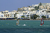 Sailboarders in front of the town of Naxos, island of Naxos, the Cyclades, Greece, Europe