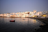Houses on the waterfront in the evening light, Naoussa, island of Paros, the Cyclades, Greece, Europe