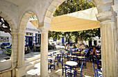 People at the terrace of a restaurant, Pirgos, island of Tinos, the Cyclades, Greece, Europe