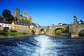 View over Lahn river with stone bridge to castle ruin, Runkel, Hesse, Germany