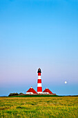 Westerheversand Lighthouse with full moon, Westerhever, Schleswig-Holstein, Germany