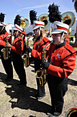 High School Band Members play saxophones at Strawberry Festival Parade Plant City Florida