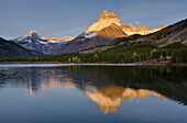 Dawn over Mount Wilbur 9, 321 ft 2, 841 m and Swiftcurrent Lake,  Glacier National Park Montana USA