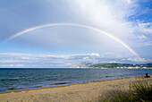 Rainbow over beach,  Laredo,  Cantabria,  Spain