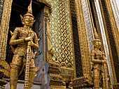 golden guardian statues at the Golden Palace in Bangkok Thailand