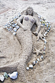 Mermaid sand sculpture on Thomas Beach near the shores of Lake Calhoun Aquatennial Beach Bash Minneapolis Minnesota USA