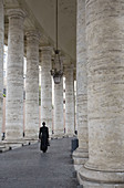 Bernini´s Colonnade with priest,  Saint Peter´s Square,  Vatican City,  Rome,  Italy